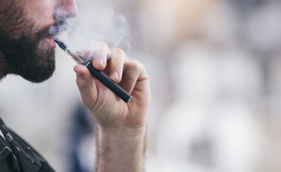 851cf1b0 b490 4a98 babc b9a3b129f064 Young male worker smoking electronic cigarette 1069317828 2313x1301